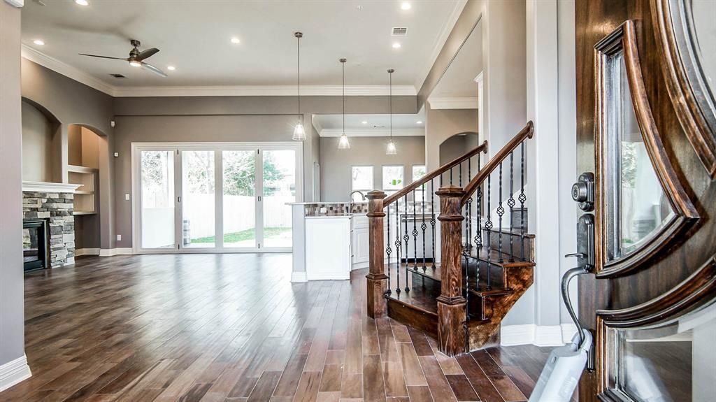 A home with hardwood floors and a staircase.