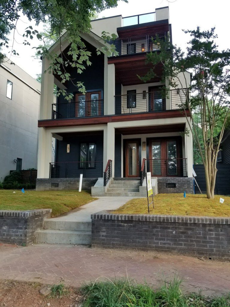 A house with two stories and a front porch.
