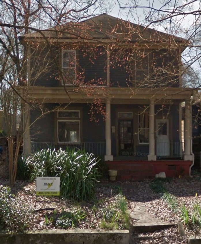A google street view of a house with a front porch.